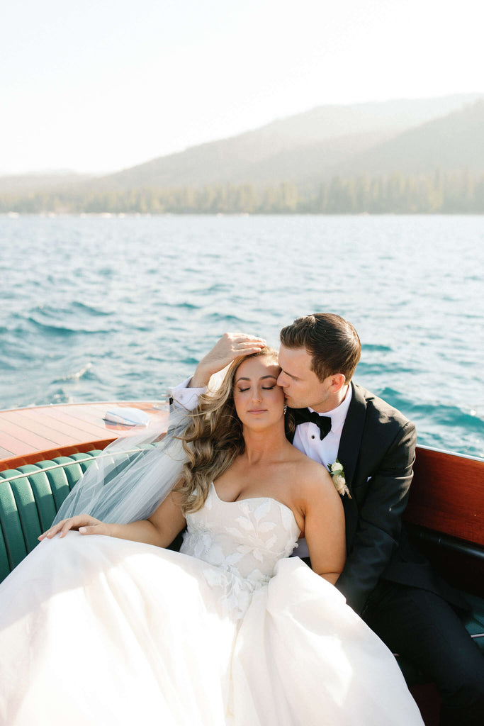 Bride and groom on a boat in Lake Tahoe