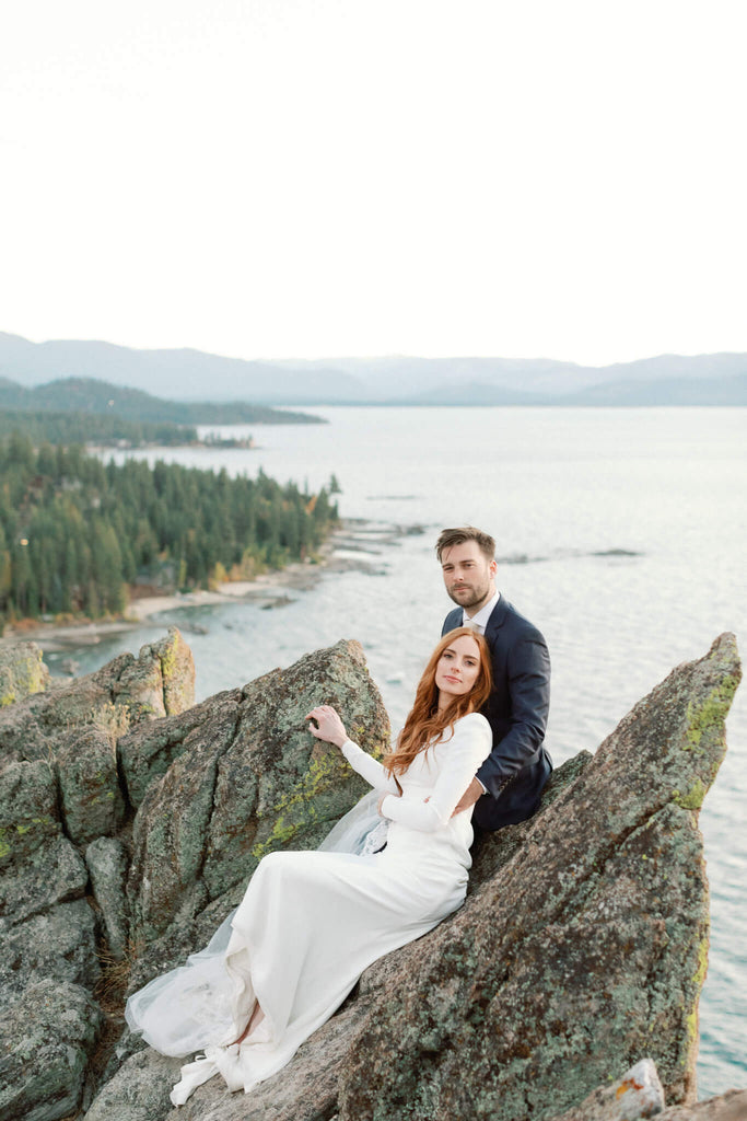 Bride and groom on the rocks in Lake Tahoe