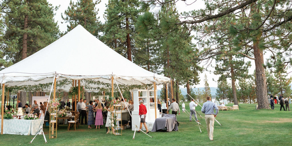Wedding party under a canopy in Lake Tahoe